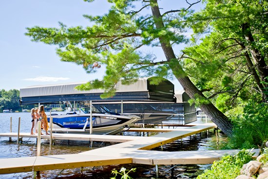 ShoreStation boat lift with canopy and customized dock